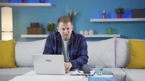 Home-office-worker-man-looking-nervously-at-camera.