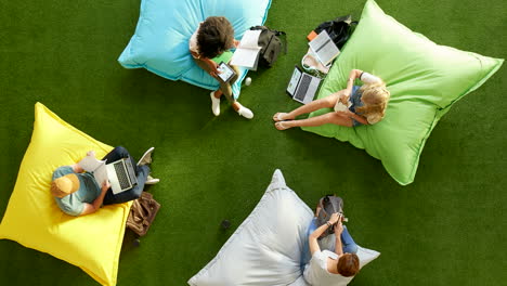 aerial view of professionals using technology