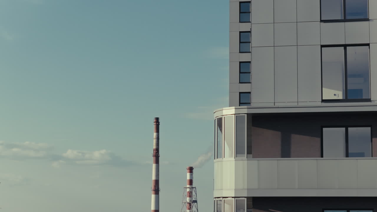 Modern Apartment Building with Balcony and Chimney