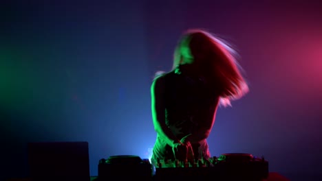 female dj performance in colorful lighting