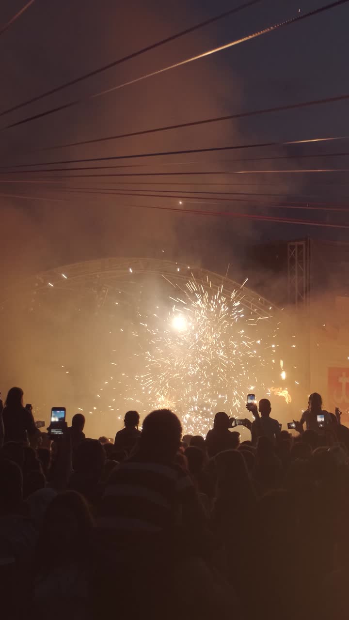 Fireworks display with a crowd