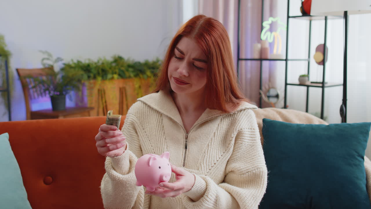 Poor young woman holding piggybank and one dollar banknote financial crisis bankruptcy poverty
