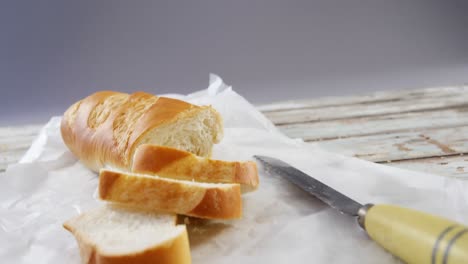 slices of baguette with knife