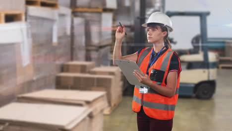 Caucasian-woman-worker-wearing-an-organe-high-vest-and-a-hat-in-a-factory-checking-stock