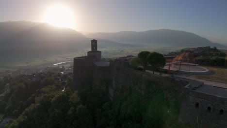 castle of gjirokastra, albania. morning sun above hill, landscape with historical landmark. drone