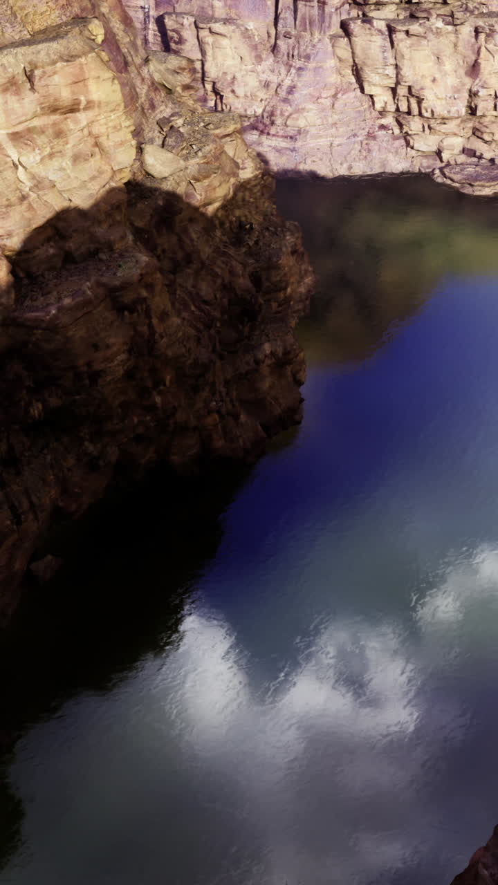 Exploring the stunning rock formations and reflections in a serene canyon