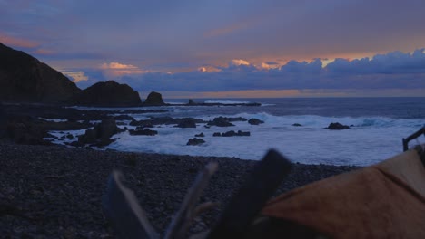 beautiful sunset over the southern ocean of australia with beach shacks in the foreground