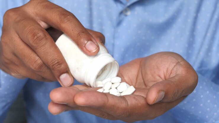 Person taking pills