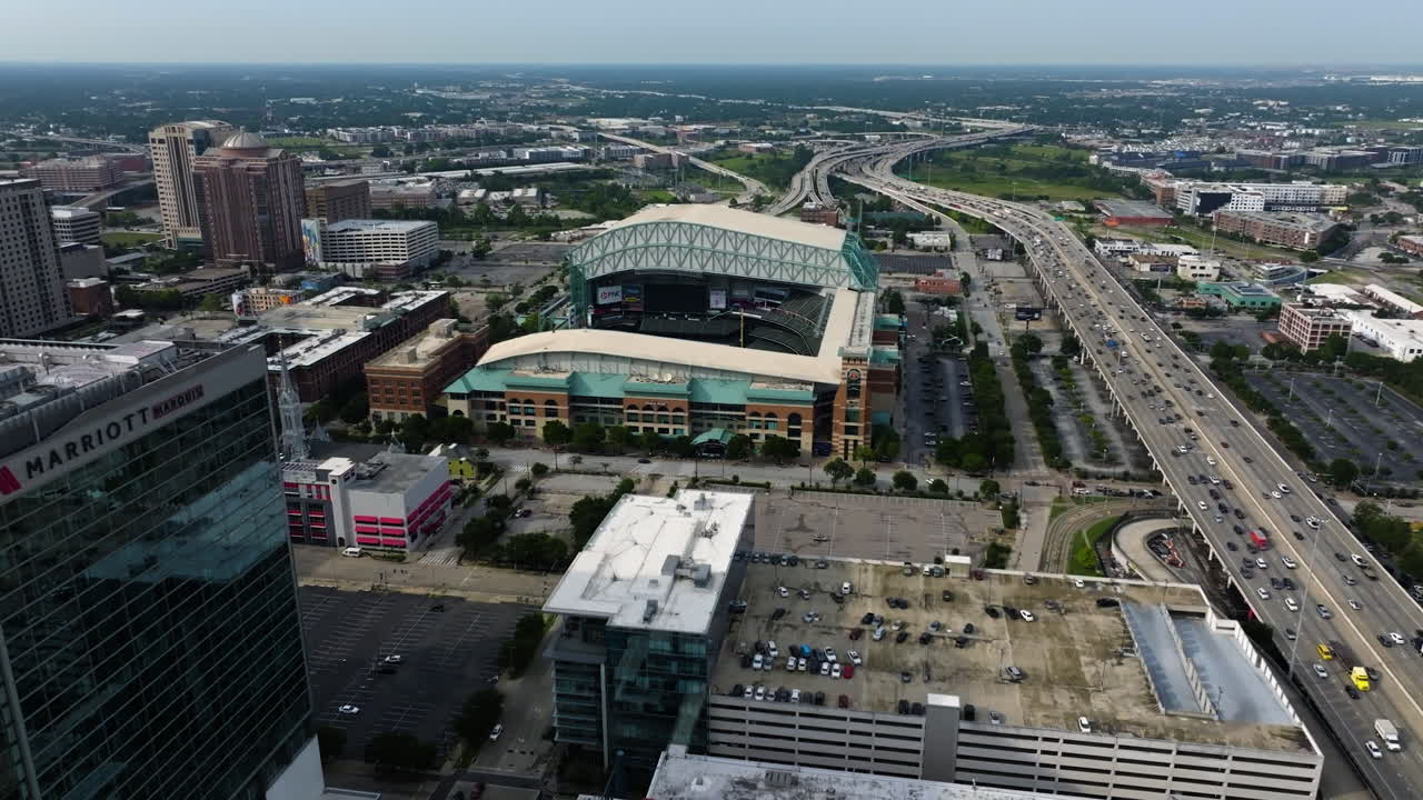 Drone approaching the Minute maid park, sunny day in Houston city, Texas, USA