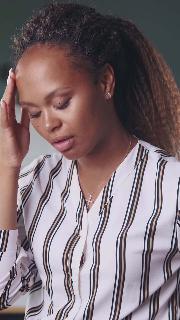 Young excited nervous african american woman trying to cope with emotions