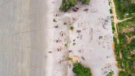 Fishing-Boats-Along-the-Shoreline-of-the-Sea-Beach-on-the-Bangladesh-Coast---Aerial-Overhead-Shot