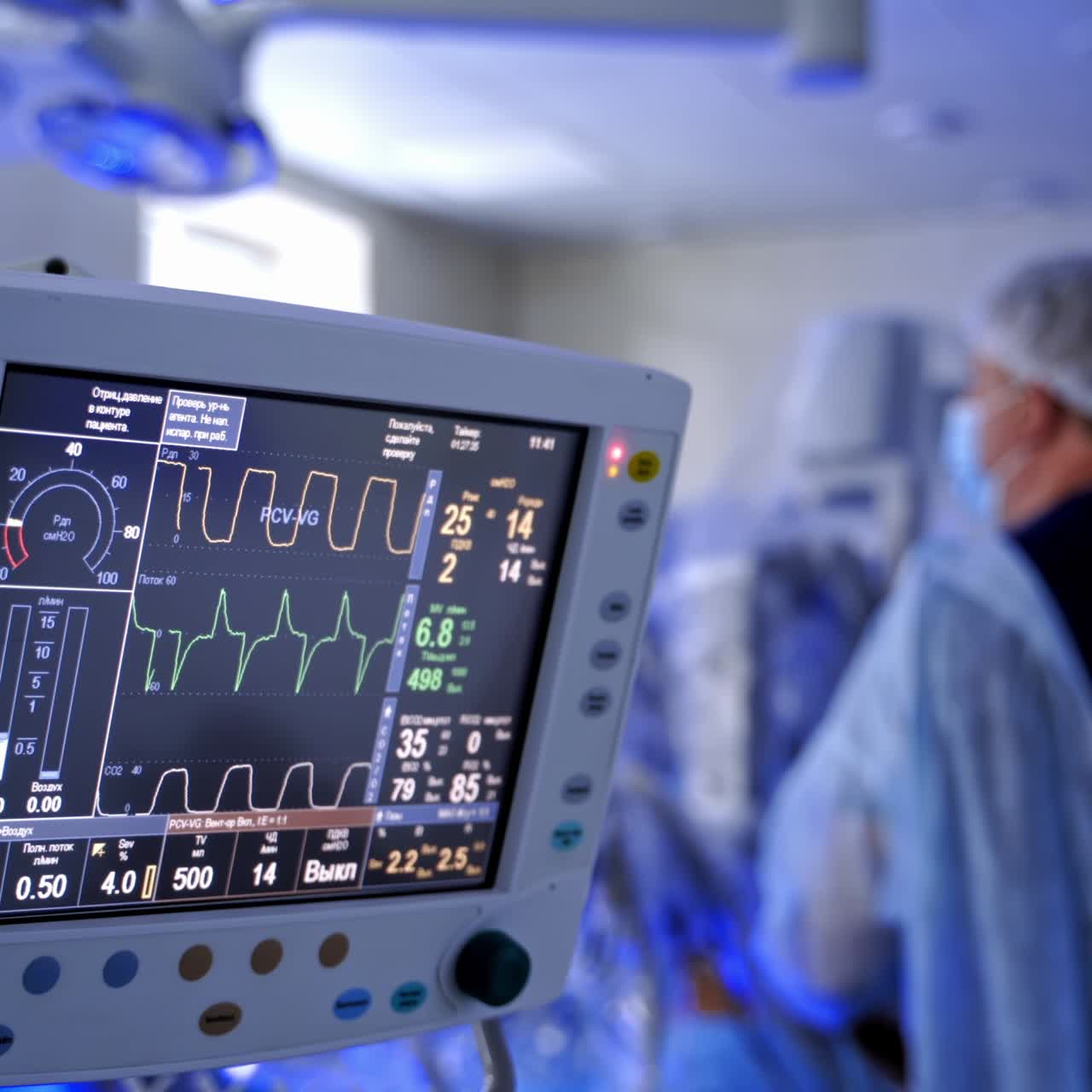 Anasthesia monitor on blur surgery background. Medical monitor shows vital signs of a patient during the operating process in intensive care unit.