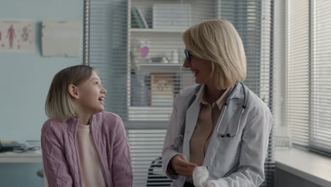 a doctor consulting with a young patient in a clinic