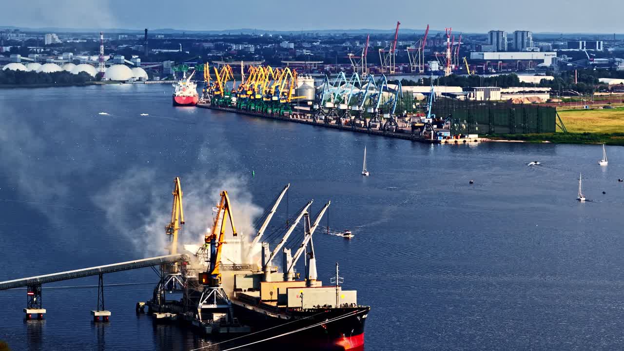Riga, Latvia Baltic Sea Port terminal, docks, cranes, storage, and shipping containers - sliding aerial reveal