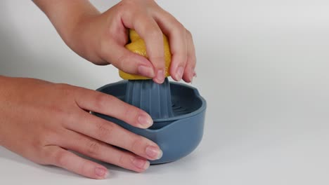 demonstration of juicing lemons and oranges manually