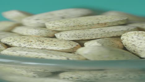 close-up of pills in a glass container