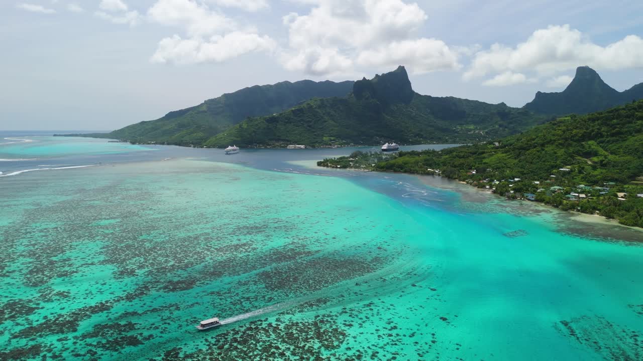 Boat tour navigating the coral waters of Moorea island