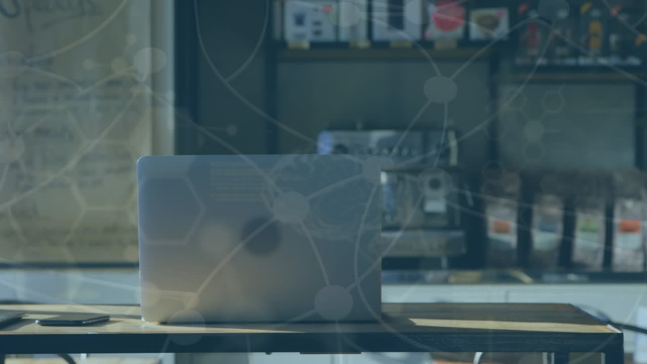 사무실 의 책상 에 놓여 있는 노트북 에 있는 과학적 데이터 의 애니메이션