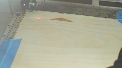 laser engraving on a piece of wood