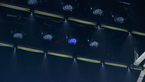 A-special-effects-rain-machine-in-a-film-cinema-studio-with-a-ceiling-full-of-film-lights