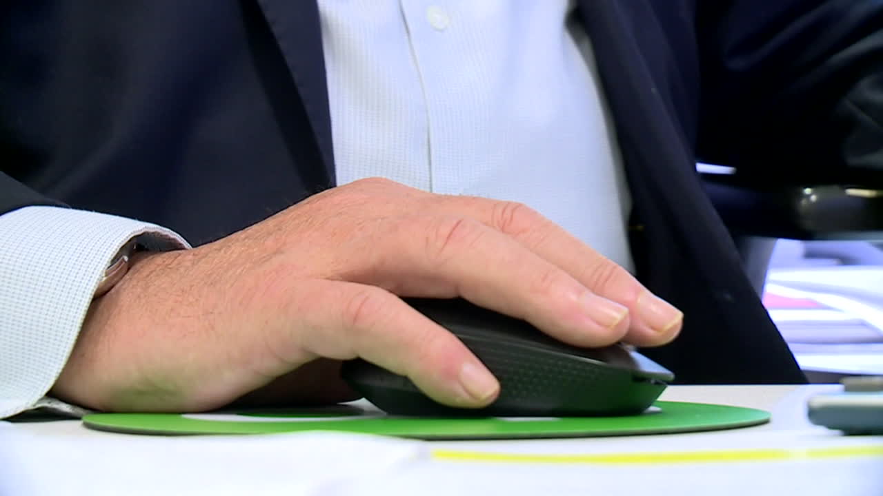 Businessman using computer mouse