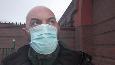 male security guard wearing protective corona virus medical ppe mask closeup