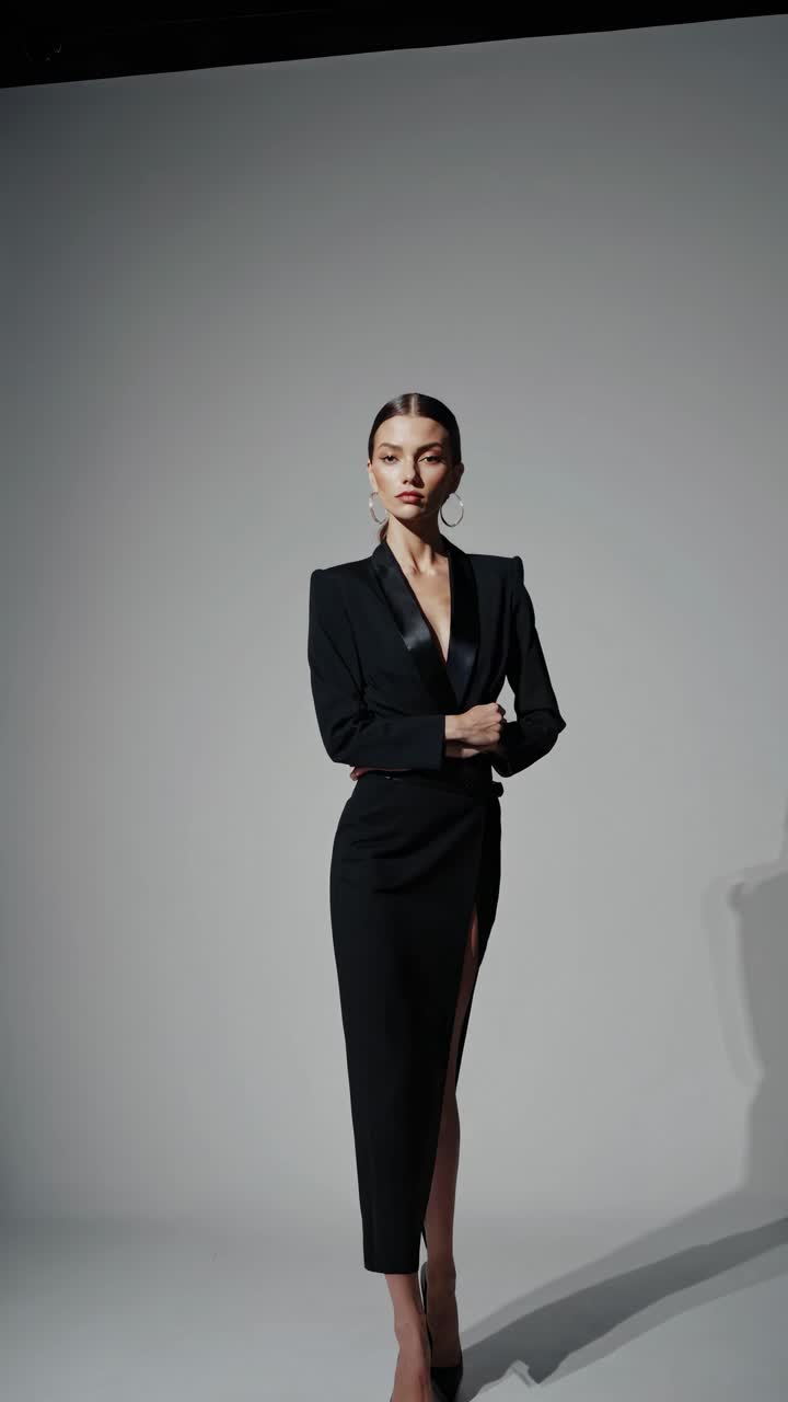 Elegant fashion video concept featuring a model in a sleek black dress
