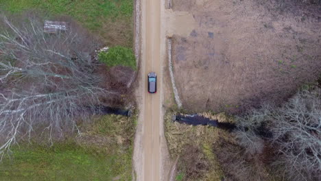 cinematic shot, car driving thru valley