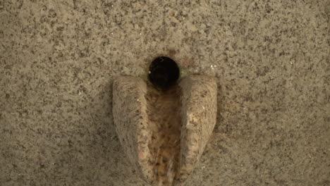 a water fountain made of granite