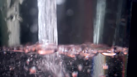 pouring water into a glass