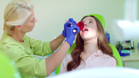 female dentist and patient in dentist office