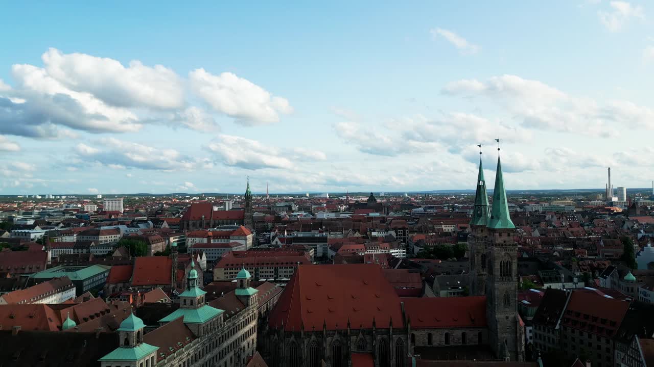 Drone flying over a city with a historic church. Scenic aerial view, perfect for travel, architecture, and urban landscape content