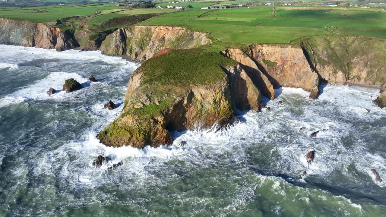 Epic Ireland storm in autumn boiling seas at The Copper Coast Waterford stunning drone seascape