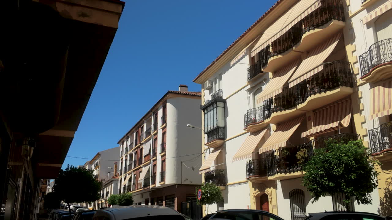 Spanish Street Scene with Colorful Buildings and Balconies