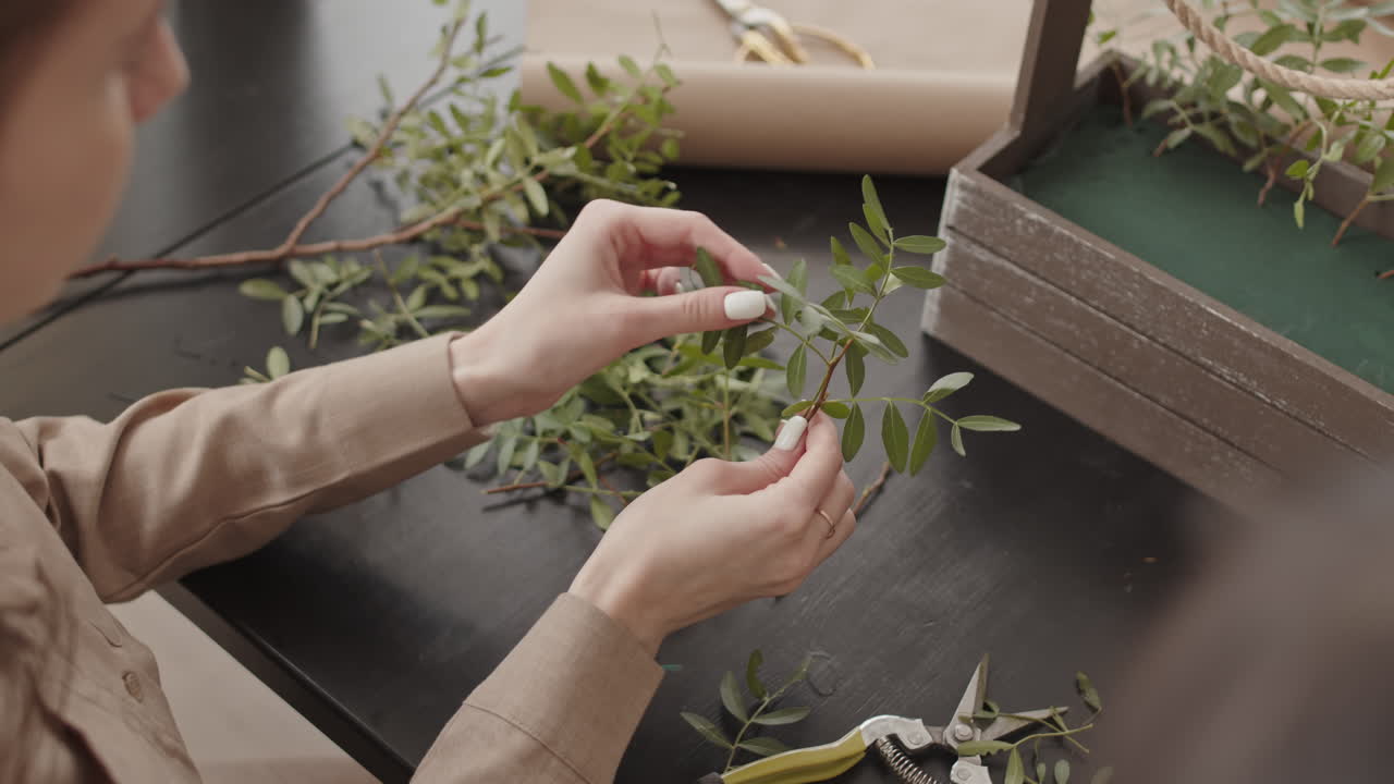 Woman making a flower arrangement