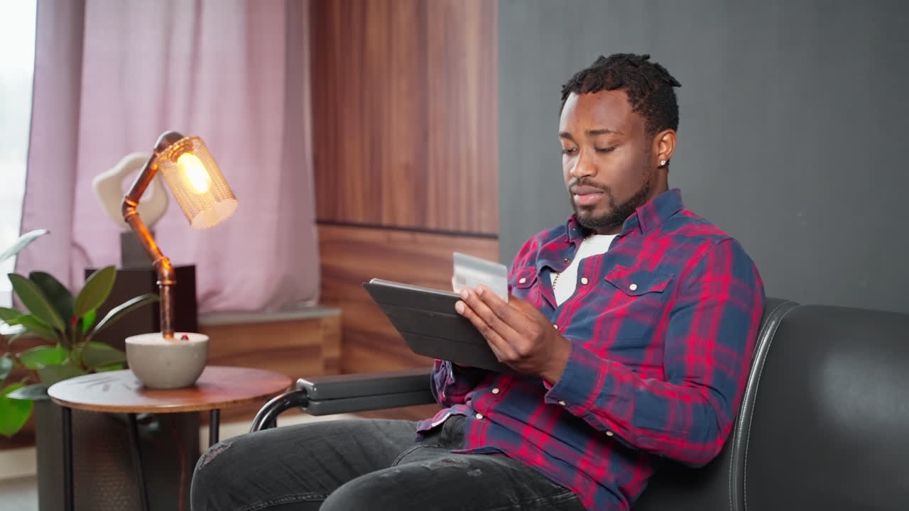Man Using Tablet in Modern Home