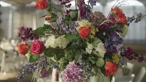 close up of flower bouquet arrangement on a wedding banquet dining table