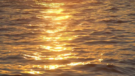 reflection of orange sky on sea surface