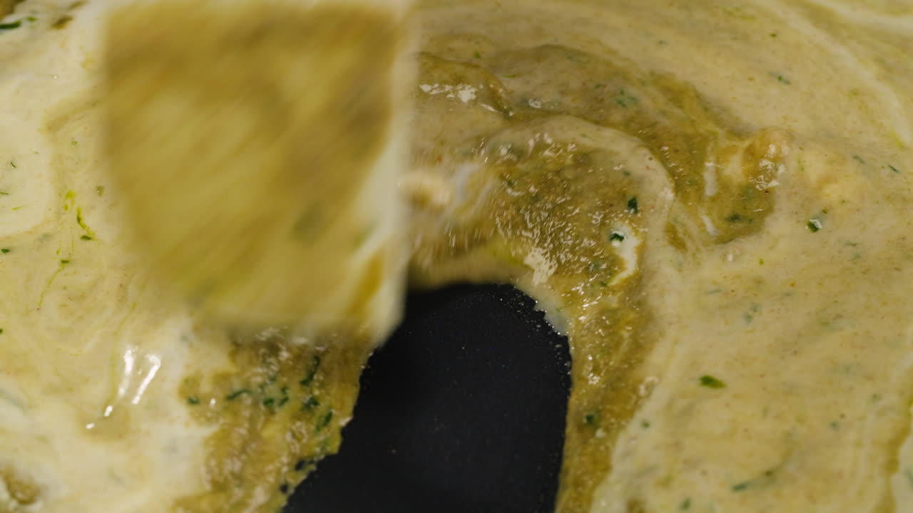 Cooking sauce with a spatula