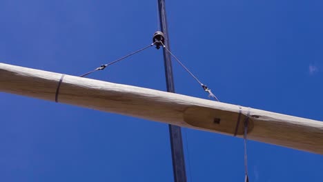 crane lifting large wooden beam