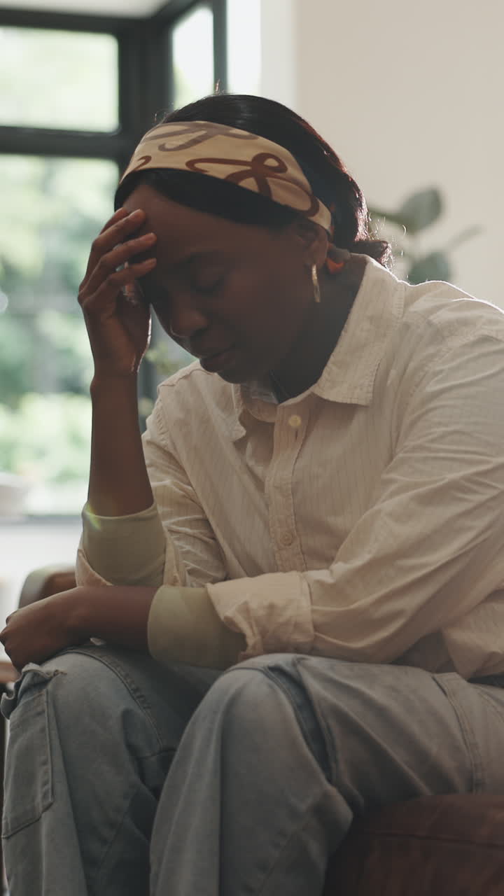 Sad Young Black Woman Sitting Alone and Feeling Distressed