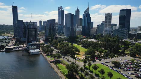 aerial view backwards movement of the perth city skyline from elizabeth quay during a sunny day