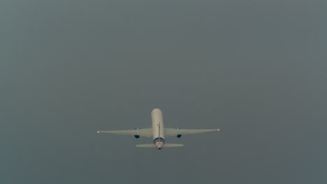 airplane in the cloudy sky