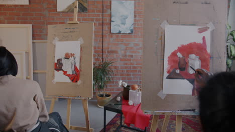 artist painting still life in studio