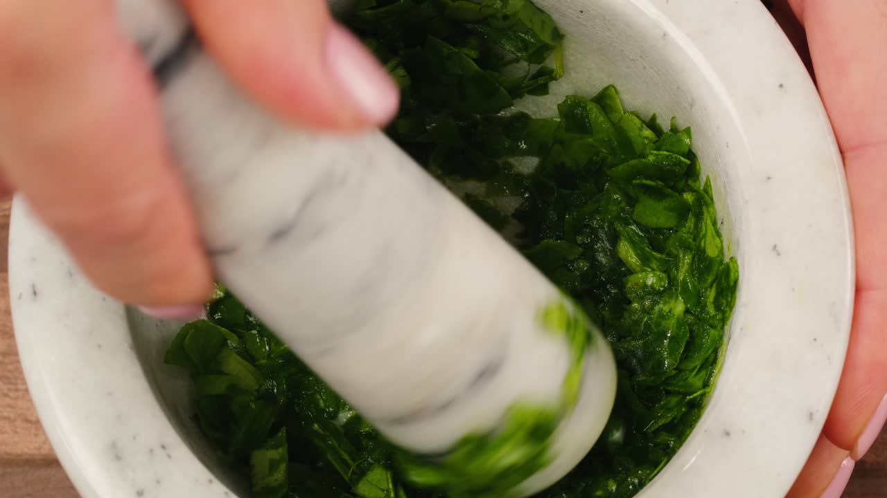 Preparing Herbs with Mortar and Pestle