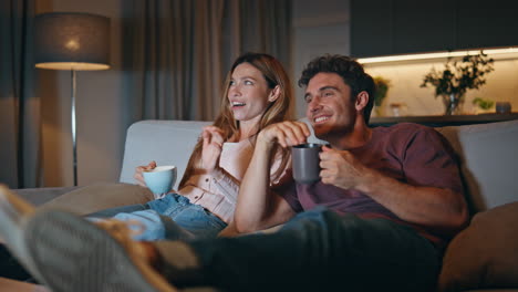 excited family watch comedy movie have good time evening room together closeup