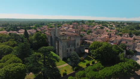 far orbiting shot of chateau de pouzilhac with a surrounding city