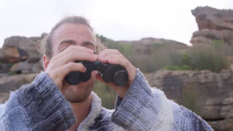 Man-looking-through-the-binoculars-4k