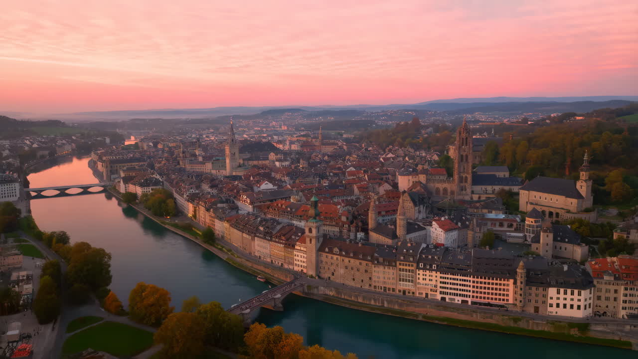 Panoramic Aerial View of a Historic European City and River at Sunset