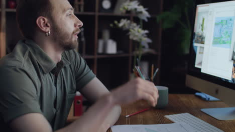 frustrated worker putting his head on desk in home office. sleep at work